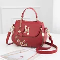 Fashionable red matte leather handbag with floral embroidery and pearl H-buckle detail - Red (Single Sided Flower)