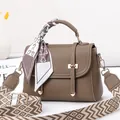 Brown litchi leather handbag with decorative silk scarf and geometric patterned shoulder strap - Coffee