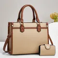 Detail of high-quality pebbled leather tote set with gold-tone hardware and crossbody strap - Khaki