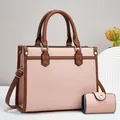 Close-up of pink litchi grain PU tote bag set with brown handles and gold hardware - Tote Handbag And Wallet Combo / Pink