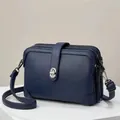 Dark blue litchi pattern leather crossbody bag with multiple zippers and silver buckle - Blue