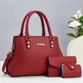 Three-piece red pebbled leather tote bag set including handbag, wallet, and card holder - Red