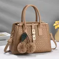 Khaki woven handbag with cherry fur charms and gold hardware for elegant commute style - Khaki
