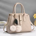 Elegant beige embossed woven texture handbag with plush cherry charms and gold hardware - Off White