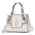 White lychee leather handbag for women featuring a silk scarf and gold leaf charm - White