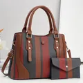 Detail of striped fabric and PU leather tote bag set with matching envelope wallet - Red