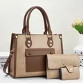 Detaillierte Ansicht des dreiteiligen Taschensets in Khaki und Braun mit Nietenverzierung - Khaki