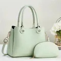 Detail of mint green lychee grain leather tote bag set with golden hardware details - Two-piece Set (Main Bag + Coin Purse) / Green