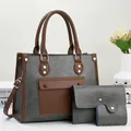 Detailansicht des 3-teiligen Shopper-Sets aus grauem Kunstleder mit braunen Akzenten - Grau