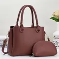 Detail view of burgundy tote bag with leather texture, golden hardware and matching pouch - Two-piece Set (Main Bag + Coin Purse) / Brown