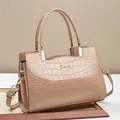 Elegant beige crocodile pattern patent leather tote bag with gold metal logo and strap - Khaki
