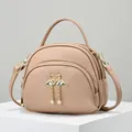 Petit sac bandoulière rose en cuir avec boucle cœur flamant et double fermeture éclair - Kaki