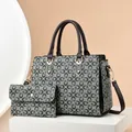 Retro grey floral tote bag set with brown handles and matching coin purse on white stand - Green