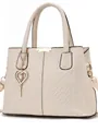 Close-up of beige lychee grain leather handbag with elegant embroidery and pearl charm - Off White