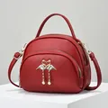 Sweet red round crossbody bag with litchi texture and swan metal decoration - Burgundy