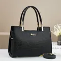 Classic black crocodile pattern handbag for women with gold hardware and top handles - Black
