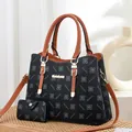 Two-piece black floral tote bag set with brown leather straps and gold metal logo - Black