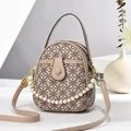 Beige textured leather round handbag with elegant pearl chain and pattern design - Khaki