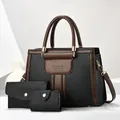 Three-piece set featuring large tote bag, folding wallet, and pouch with gold metal accents - Black
