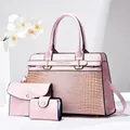 Detailed view of pink 3-piece bag set with shiny patent leather and crocodile texture - Three-Piece Set / 30cmx11cmx21cm / Pink
