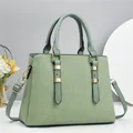 Detail of light green tote bag featuring pleated texture and gold metal hardware - Green