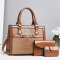 3-piece set of caramel crocodile embossed tote bag, clutch, and card holder in glossy finish - Brown