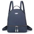 Detailed front view of navy blue backpack showing textured fabric and silver metal zippers - Blue