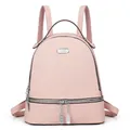 Front detail of a large light pink travel backpack with silver chain zipper and woven texture - Pink