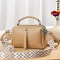 Brown leather pillow bag with wide geometric pattern strap and lychee grain texture - Khaki