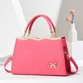 Chic hot pink tote bag with gold bow detail and detachable strap for women - Pink