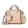 Detail of elegant beige leather handbag with cute cat-shaped coin purse and metallic logo - Khaki