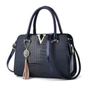 Navy blue crocodile pattern tote bag with golden V hardware and stylish tassel details - Blue
