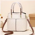 Beige bucket bag with hexagonal geometric pattern and brown adjustable shoulder strap - Diamond Lattice Creamy White