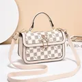 Beige checkered crossbody bag featuring golden swan buckle and chain fringe detail - Off White