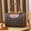 Dark brown Boston handbag for women with monogram print and adjustable shoulder strap - Coffee/Ochre