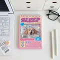 Close-up of spiral weekly planner with cute dog design on a desktop workspace - Daily Plan - Puppy