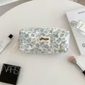 Quilted floral pencil pouch in cream white with blue patterns and a cute ribbon zipper - Little Floral