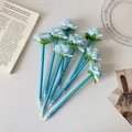 Close-up of creative blue rose pens with realistic petals and polished blue stems - Blue