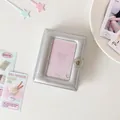 Detail of silver metallic photocard album with star relief and secure snap button - Silver
