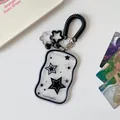 Detail of wavy star-patterned card holder with black spring lanyard and bell charm - Black