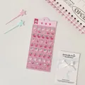 Detailed view of 3D resin strawberry and bow stickers for DIY planner decoration - Strawberry