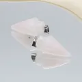 Arrowhead rose quartz stone pendants with silver metal clasps in a mirror layout - Rose Quartz