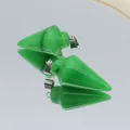 Arrowhead green malachite stone pendant with silver clasp on a reflective surface - Green Chalcedony