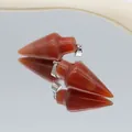Pair of arrow-shaped red agate stone pendants with polished finish and silver metal bails - Red Agate