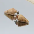 Arrowhead pendant made of spotted natural stone with silver metal bail on mirror - Jasper