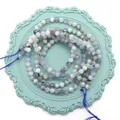 Cuentas de piedra natural tallada en gris claro y azul para collares artesanales - Aguamarina