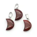 Three crescent-shaped red jasper pendants with silver metal bails on white background - Red Jasper
