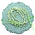 Perle rotonde sfaccettate in pietra naturale verde chiaro per creazione gioielli - Prehnite