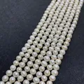 Strands of white near-round natural freshwater pearls with lustrous finish - Small Specification / White