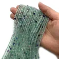 Cuentas de fluorita natural tallada en verde y púrpura para crear joyas - Fluorita Verde